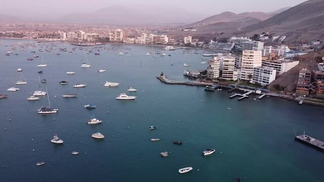 Rotational aerial drone view of the boats at the harbor