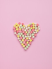 A heart figurine made of small multicolored marshmallow pieces. The concept of Valentine's Day.