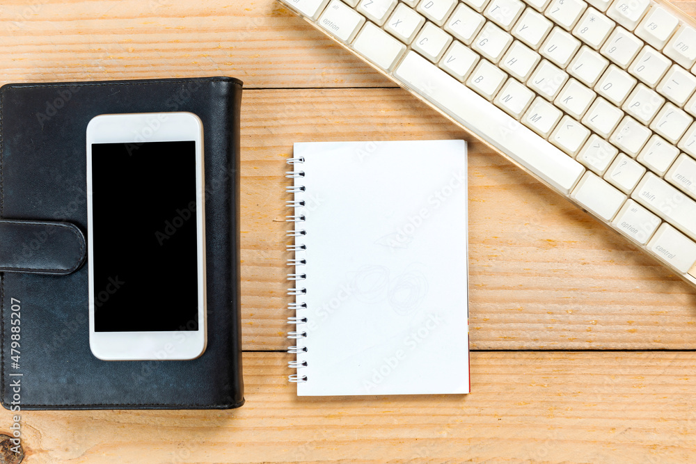 Poster computer keyboard and note book with a mobile phone