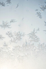 Obraz premium Abstract frost pattern. Frozen noisy window on the cold winter. Texture of ice on window. 