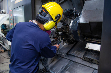 working on an industrial machine