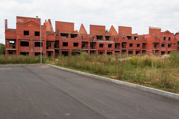 unfinished red brick apartment building