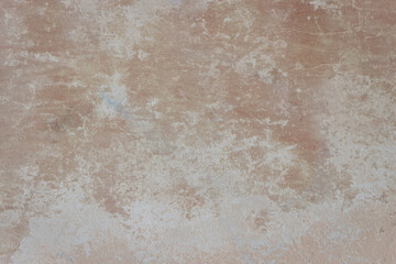 Old beige wall with brown spots covered with cement. Ugly wall but beautiful texture.