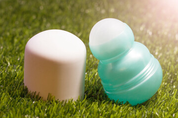 Ball deodorant on grass, natural cosmetics