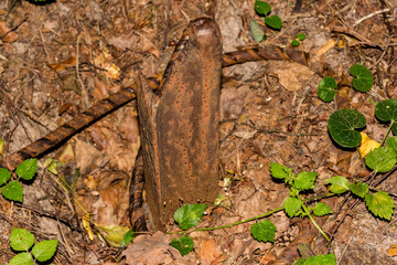 Iron rail buried in the ground, old geodetic datum point