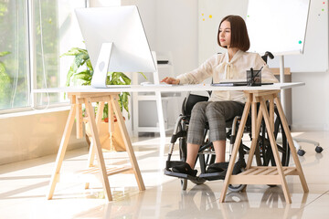 Young woman with physical disability working in office