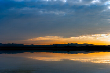 salt lake and the reflection of the mountain and the blue in the lake