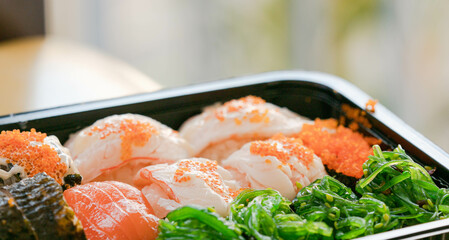 Japanese food. ็Philadelphia roll sushi with salmon, prawn, avocado, cream cheese. Sushi menu,  looks delicious.