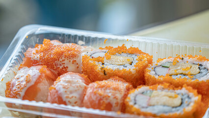 Japanese food. ็Philadelphia roll sushi with salmon, prawn, avocado, cream cheese. Sushi menu,  looks delicious.