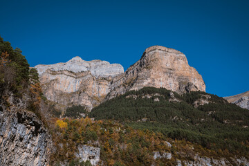 Mountains in a blue sky with clouds day, in Torla, Huesca, Aragon, Spain. Alpine canyon landscape...