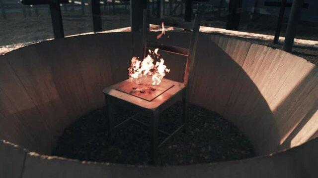 Interior of one of the pavilions of the Steilnesset Memorial in Vardo. The perpetual flame is projected from the fixed metal chair. Slow-motion, pan out.