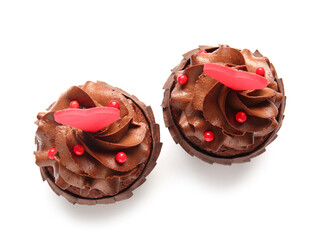 Tasty chocolate cupcakes for Valentine's day on white background