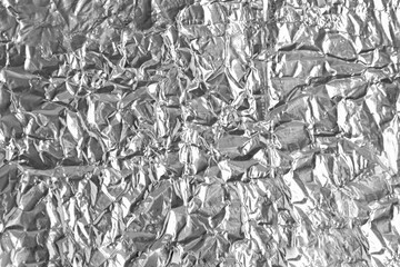 Foil crumpled old silver background abstract texture pattern beautiful design for backdrop close up.