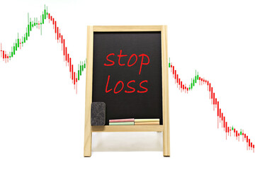 Stop loss blackboard,chalk and blackboard eraser,price chart bar graph low price isolated on white  background.