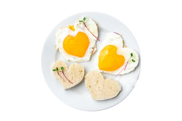 valentines day fried egg breakfast on the table scrambled eggs heart shape holiday decoration love date copy space food background