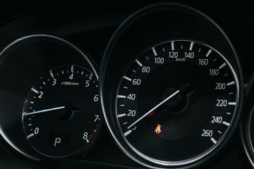 close up of the speedometer with rpm and km meter