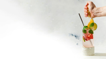  Cooling lemonade banner with strawberries and mint in a glass. Copy space.