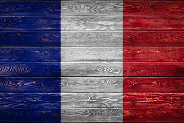 The national flag of France. is painted on a camp of even boards nailed with a nail. The symbol of...