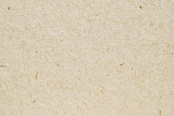 A sheet of brown recycled craft paper texture as background