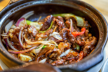 A pot of delicious and authentic traditional Cantonese cuisine in a hot pot, fat beef in a hot pot