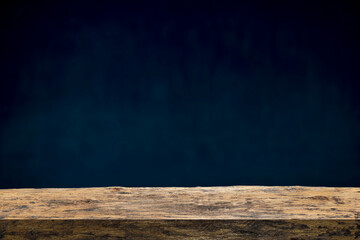 Wood table on dark background.