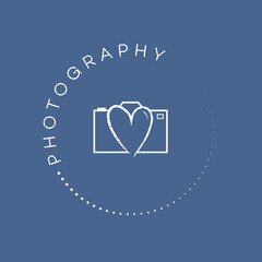 White photography stamp logo on a blue coloured background. Wedding photographer logo. With love camera icon. Romantic logo design. Hand drawn stamp icon.