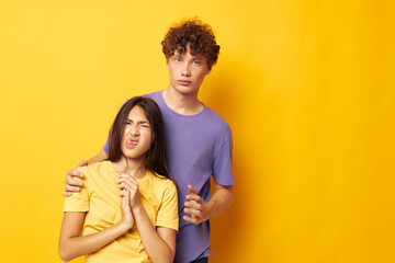 young boy and girl in colorful t-shirts posing friendship fun Lifestyle unaltered