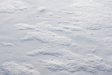 Fototapeta na wymiar beautiful snowy field in winter after snowfall, snowy background texture