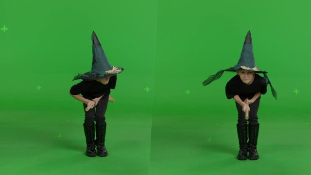 Young woman in a witch hat and black clothes flying on broomstick over green screen background. Halloween concepte. Chroma key. Front and side view 4k uhd video
