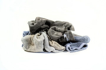Pile of old socks on white background