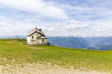 A beautiful view of Kronplatz (Plan de Corones) with mountain range in background
