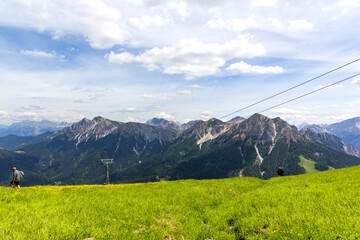 Obraz premium A beautiful view of Kronplatz (Plan de Corones) with mountain range in background