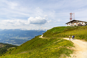 Fototapeta na wymiar A beautiful view of Kronplatz (Plan de Corones) with mountain range in background