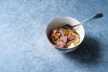Porridge with Ruby Chocolate, Candied Orange Slices and Chia Seeds.