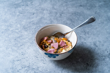 Porridge with Ruby Chocolate, Candied Orange Slices and Chia Seeds.