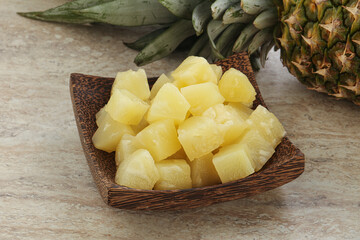 Marinated pineapple slices in the bowl