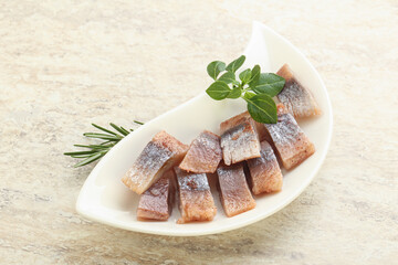 Delicous sliced herring fillet in grape sauce