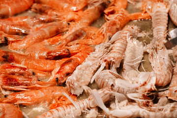 Paella. Large frying pan cooking a plate with rice and seafood.