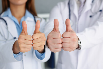 Doctors hands show ok or confirm sign with thumb up