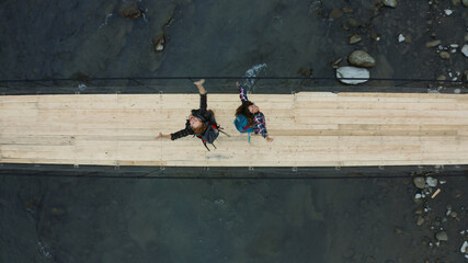 Drone bridge couple dancing enjoying each other river vacation journey concept