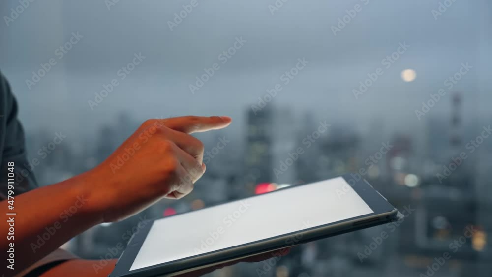 Poster people using a tablet pc in front of the city.