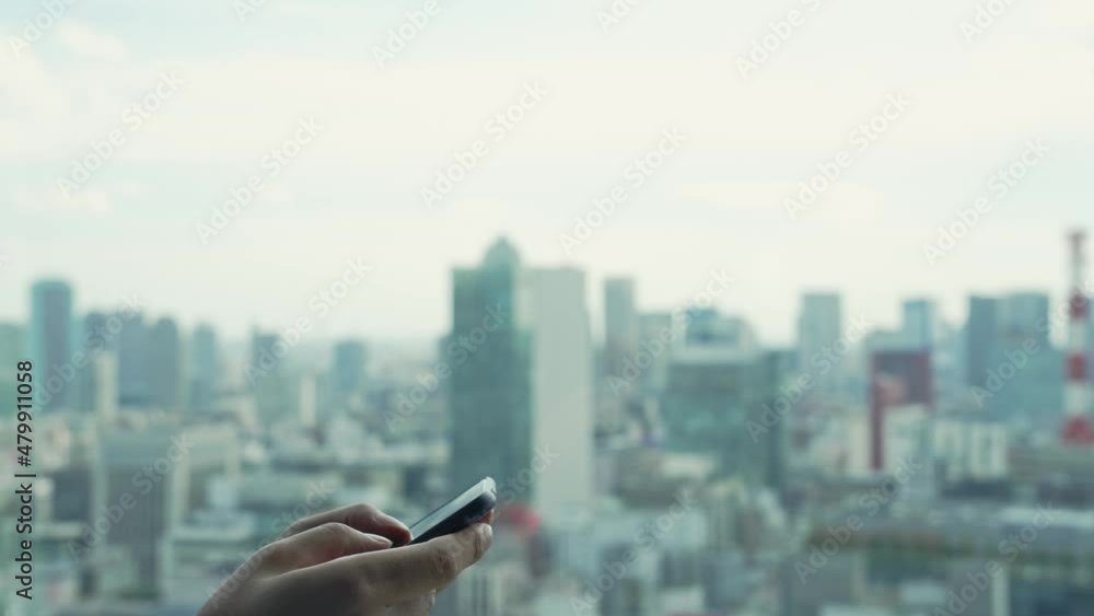 Poster people using a smart phone in front of the city.