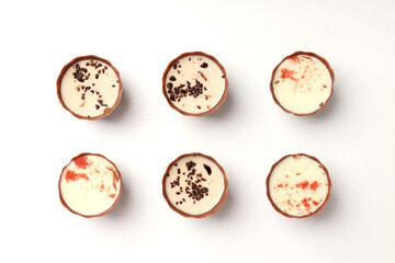 Flat lay composition with chocolate candies on white background