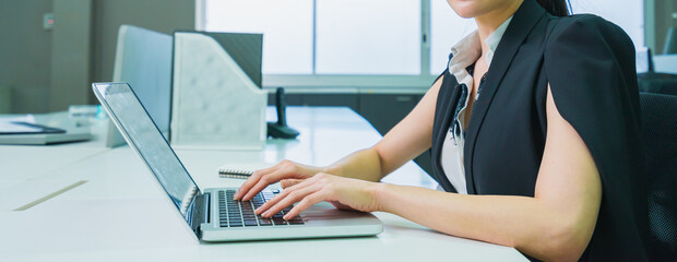 women worker using laptop to work in office workplace