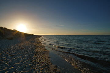 View over the beach to the Baltic Sea at sunset.