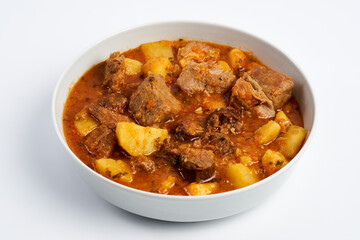 Potato stew with pork and sausages