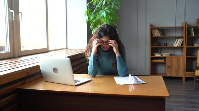 Irritated critic, editor or writer tired of editing and work with papers furious crumpling throwing away documents. Overworked stressed female disappointed and unsatisfied suffer from burnout at work