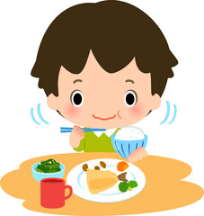 よく噛んで食事をする男の子