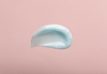 Liquid cream cosmetic, smudge texture pastel beige background
