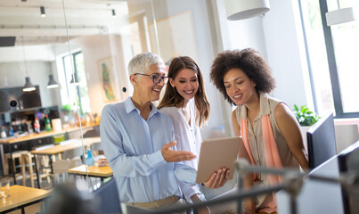 Group of happy business people discussing and working together during a meeting in office